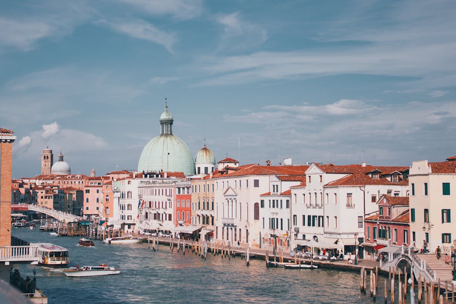 Explore the iconic cityscape of Venice's Grand Canal with stunning architecture and vibrant colors.