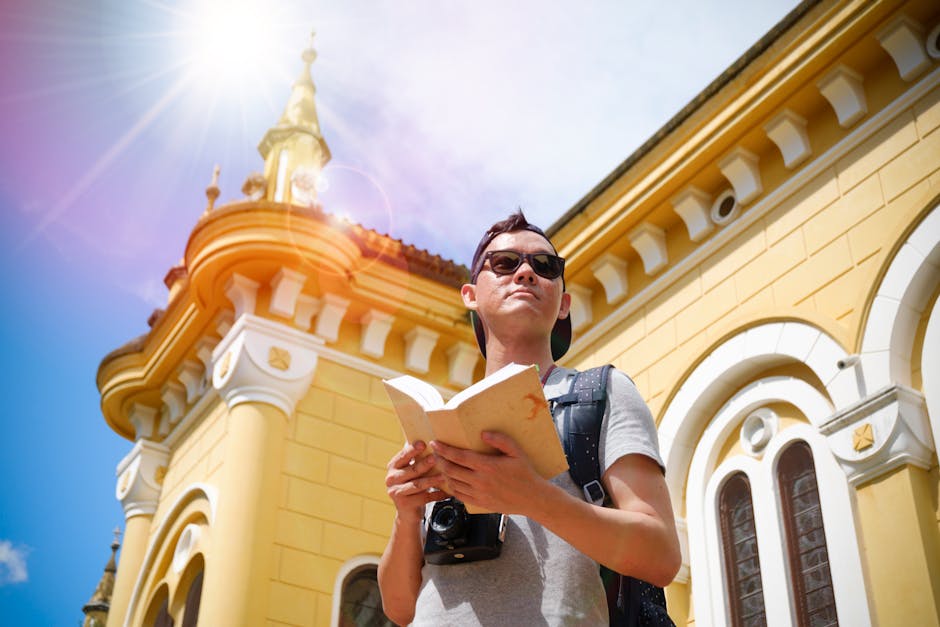A tourist with a camera explores a sunny historical landmark, enjoying the summer day.